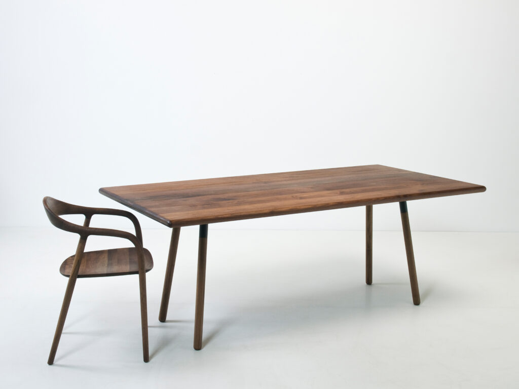 furniture design dining table multi-tree masiv wood walnut round designer furniture with wooden legs matching armchair neva artisan design by f maurer 1